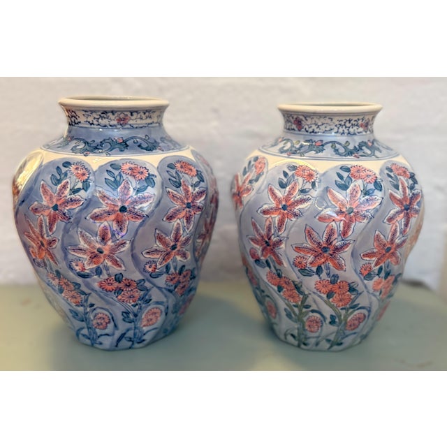 Vintage Chinese hand-painted vases, a pair. Elegant and mirror-matched, this pair of vintage ceramic vases features soft...