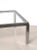 - Large coffee table from the 1970s - Faceted structure in chromed steel - Thick glass top