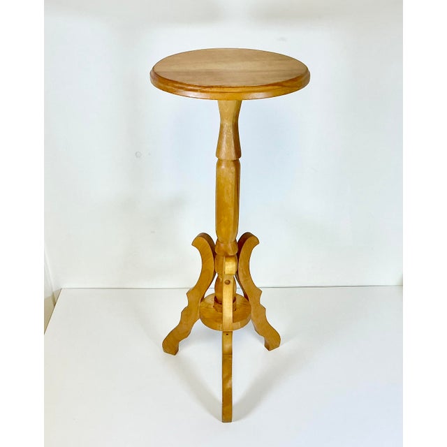 This is a delightful vintage Plant Stand. It’s a pedestal style in Maple wood. The top is round and supported by three...