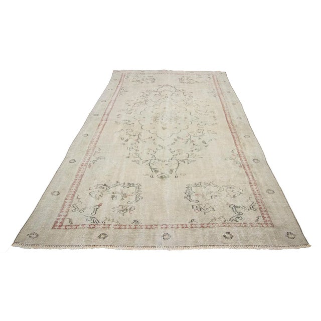 Washed Out vintage handknotted rug from Oushak region of Turkey. Approximately 50-60 years old. In very good condition