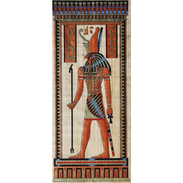 Behold the powerful falcon god Horus in this impressive Egyptian papyrus artwork. Measuring 42 x 25", this piece showcases...