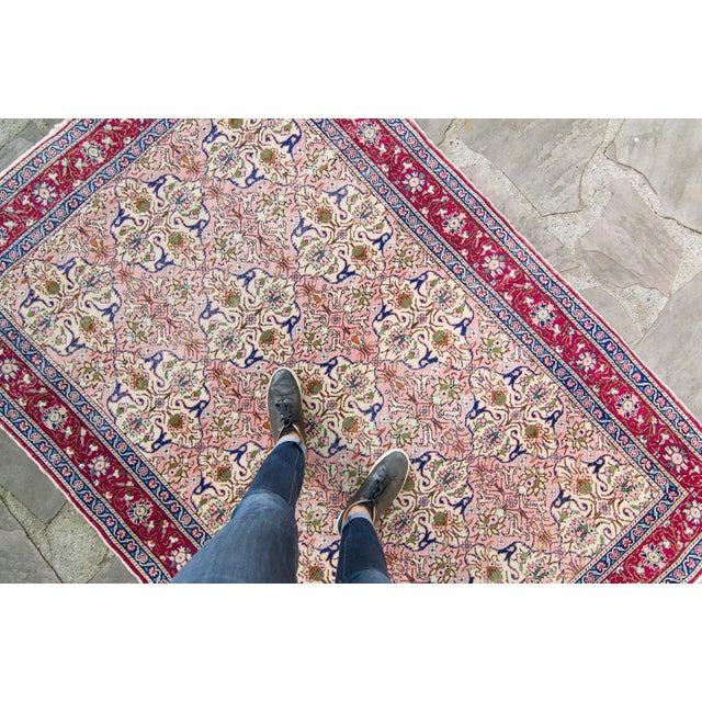 This gorgeous hand knotted Kayseri rug displays abstract allover design featuring a color palette of pink, navy blue,...