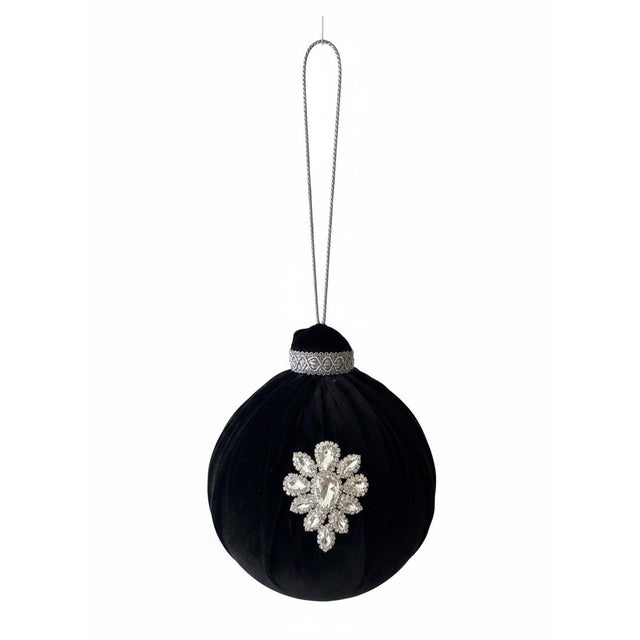 These oversized black velvet Christmas baubles bring dramatic elegance and a couture-level finish to holiday décor....