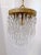 Italian layered chandelier with brass plated rim, octagon chains and 30% leaded U-drop crystals. It has 1 Edison base...