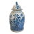 This porcelain ginger jar, measuring at 18.5" in height and 10" in width, features a hand-painted chinoiserie design...