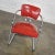 Fabulous Streamline Modern cantilever chair comprised of chrome frame and tomato red vinyl faux leather upholstery...