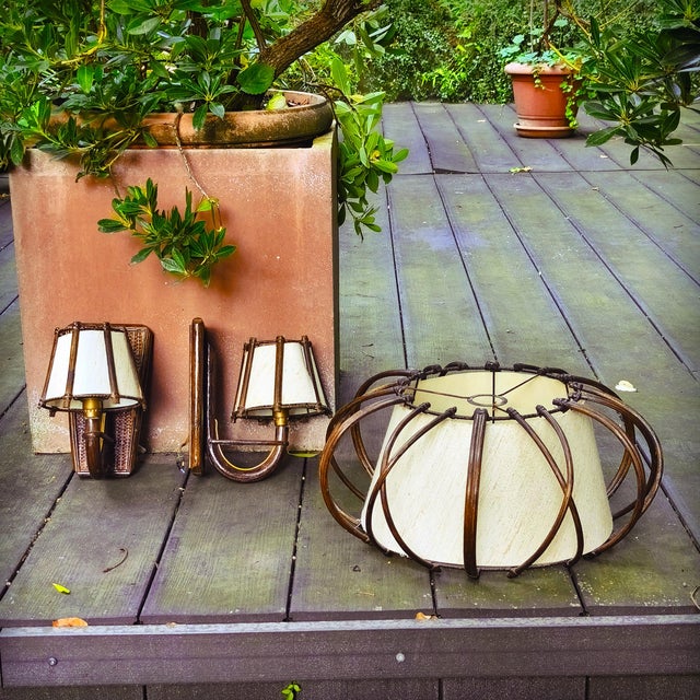 Large and elegant pendant light characterized by its curved rattan hoops enclosing a white/beige fabric shade. The two...