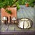 Large and elegant pendant light characterized by its curved rattan hoops enclosing a white/beige fabric shade. The two...