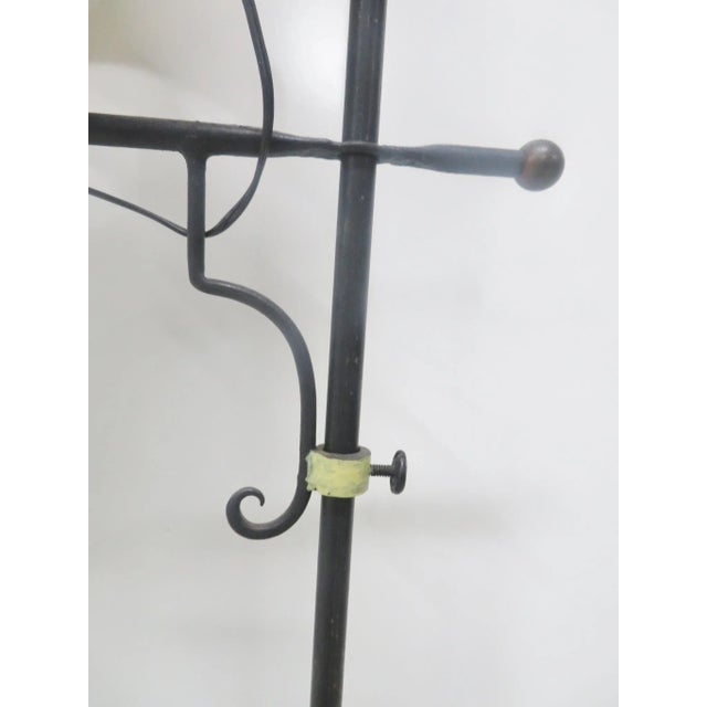 1910- 1920's arts & crafts iron floor lamp with paint decoration , inset tile in the base .