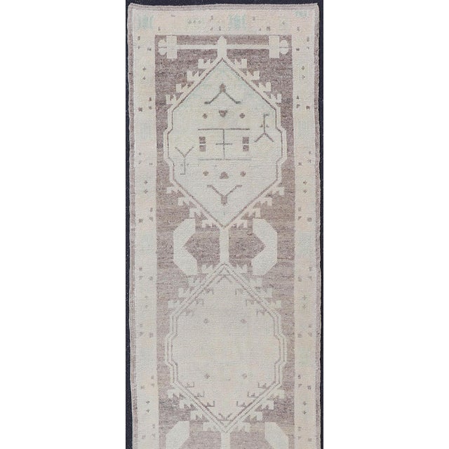 Measures: 2'10" x 17'10" Geometric Medallion Design Turkish Oushak Runner in Soft Neutral Tones. Keivan Woven Arts / rug...