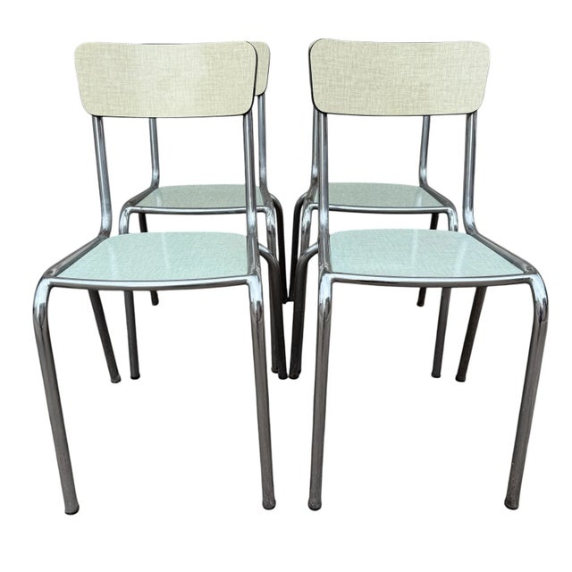 Magnificent set of 4 Formica kitchen chairs from the 50s. The frame is in chromed steel, the seat in water green Formica...