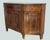 We offer this important Italian sideboard, crafted in the very early 19th century, a striking piece that combines...