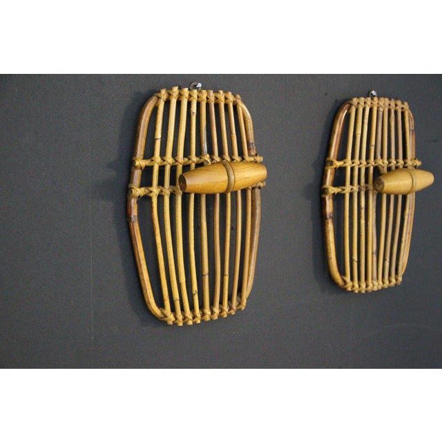 These highly decorative rattan and bamboo coat racks were made in Italy in the 1960s. They are characteristic of the style...