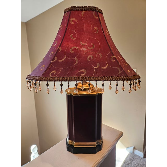 Vintage brass and red leather tea caddy style lamp. We love the patina that this piece has. The shape is rectangular with...