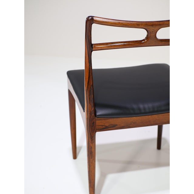 This set of six Model 94 dining chairs was designed by Johannes Andersen and produced by Christian Linneberg Møbelfabrik...