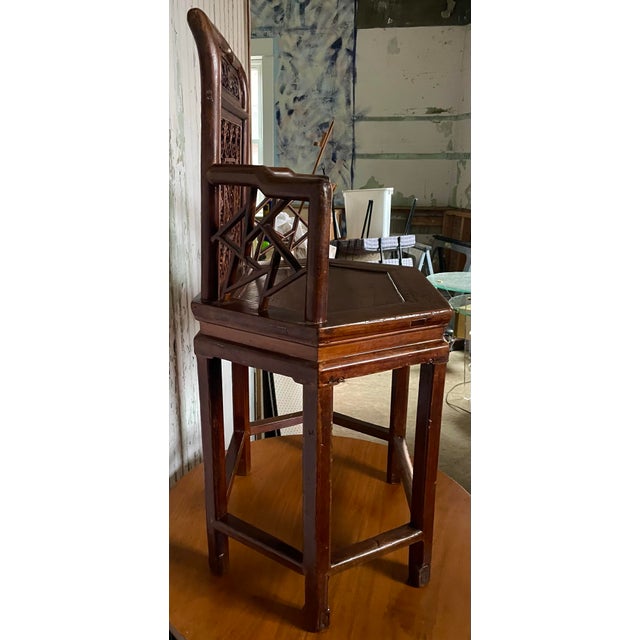 This is the sweetest small chair with a wonderful carved and cut out woman in what looks like a garden in the center back...