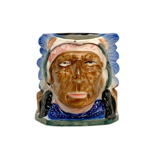 Vintage Toby head creamer pitcher featuring a sculptural Native American chief design with hand-painted glaze details and...
