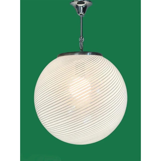 Amazing mid-century "reticello" white and crystal murano glass chandelier. This wonderful item was produced in italy...