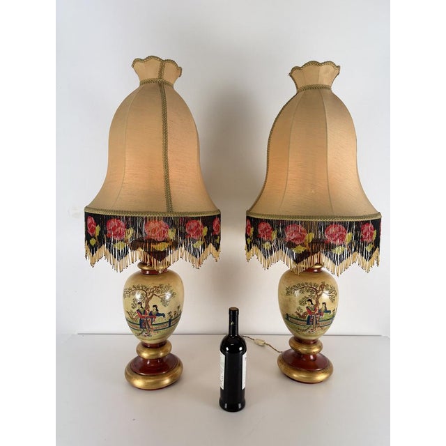 Set of two large Satsuma-style oriental table lamps, 1950s. Depicts scenes inspired by Satsuma-style geishas. Shaped...