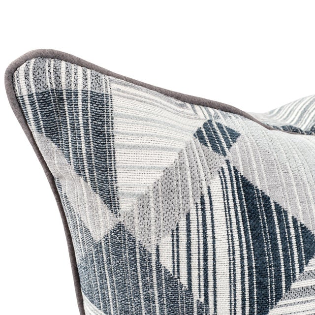 Add a touch of modern edge with this dynamic geometric jacquard fabric in cool tones of navy, steel, and silver. Intricate...