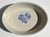 Late 1970s Pfaltzgraff Yorktowne Oval Baking Dish with a cream-colored, light gray stoneware body and a blue floral...