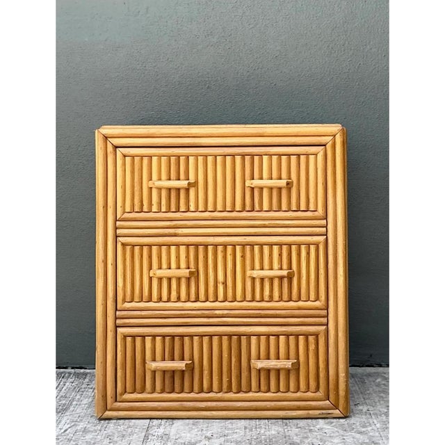 This vintage rattan three-drawer chest embodies the clean, tropical modern aesthetic beloved in mid-century casual...