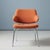 Stylish upholstered armchair from the 1970s, a representative example of mid-century modern design. The piece combines...