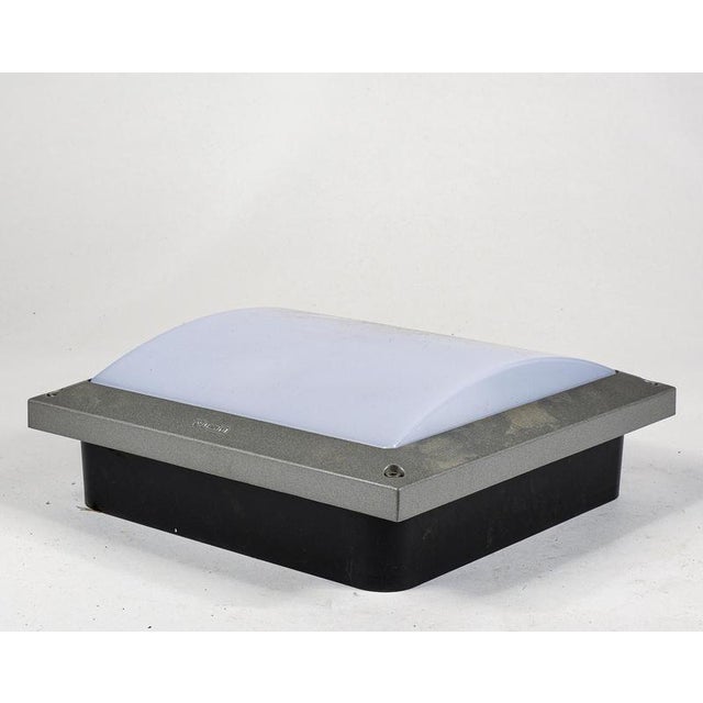 We present an outdoor wall or ceiling light from the renowned italian company i guzzini, a piece of modern design dating...