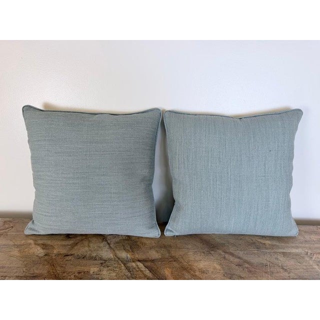 An exceptional pair of custom throw pillows featuring a luminous printed cotton with a large-scale Venetian floral motif....