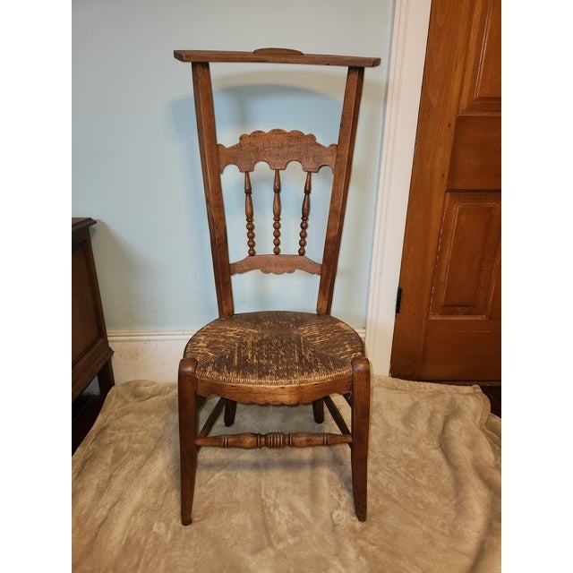 Step back in time with this Late 19th Century Victorian Library Chair, also known as a Prayers Chair, crafted with a...