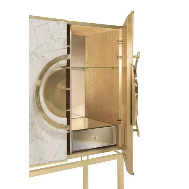 Secret bar cabinet by memoir essence dimensions: d 50 x w 90 x h 165 cm. Materials: brushed brass, gold leaf and white...