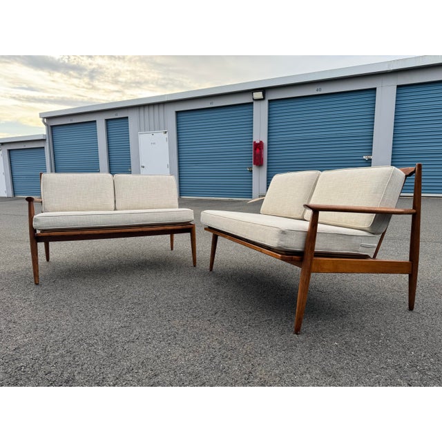 Two piece walnut sofa with by Viko Baumritter newly upholstered in a durable oatmeal linen-blend fabric with subtle...