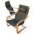 A sculptural Mid-Century Modern pair of lounge chairs designed by Noboru Nakamura for IKEA, featuring curved wood frames...