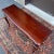 A late 20th century Pennsylvania House Traditional Queen Anne style solid cherry console or sofa table having a scalloped...
