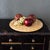 A lovely 19th-century English bread board features a wide, hand-carved wreath border, most likely made from Sycamore or...