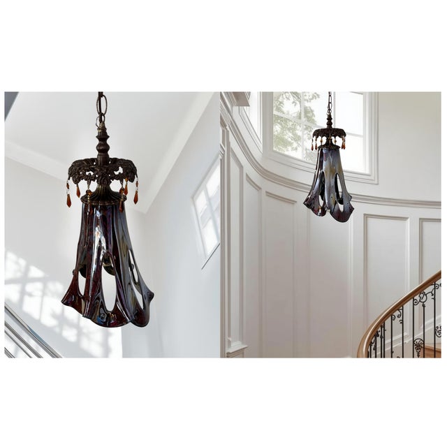 This striking pendant features a handblown glass shade crafted in Poland using the fazzoletto technique, known for its...