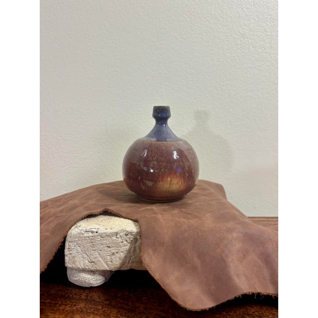 Vintage mid-century modern American studio pottery bud vase with a beautifully balanced, sculptural form. The rounded body...