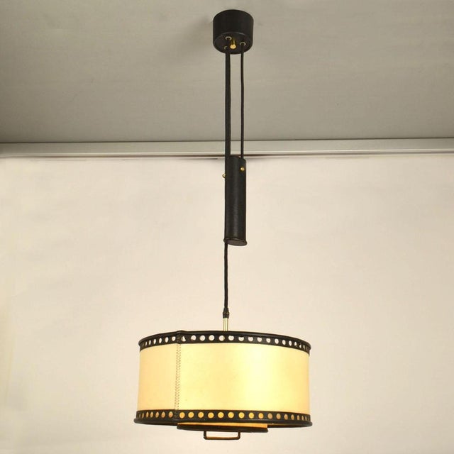 Counterbalance pendant with centre weight. High quality hand made drum shade in real parchment and black leather moves...