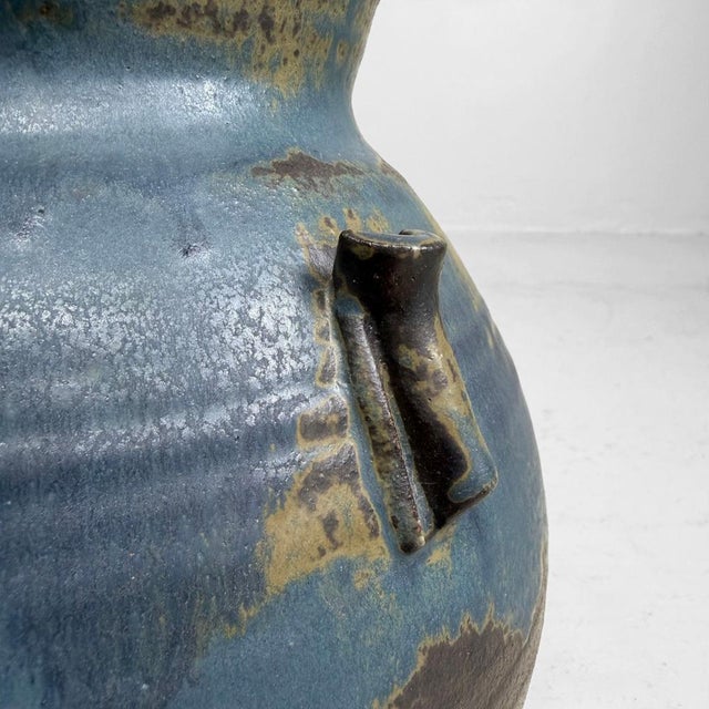 This vintage Japanese ceramic vase has a full, rounded body, a narrowed neck and a wide, gently flared mouth. Dimensions:...