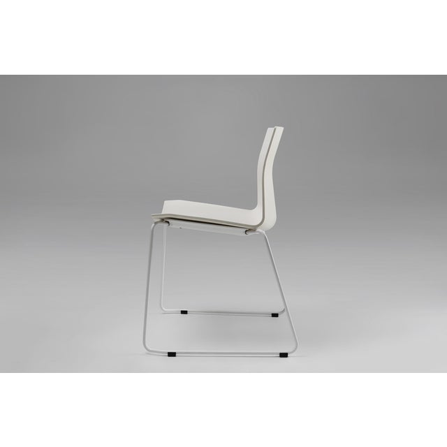 Belgium / 2000 / chair / plastic, metal / Mid-century / Design A sleek white chair with metal frame designed in Belgium....