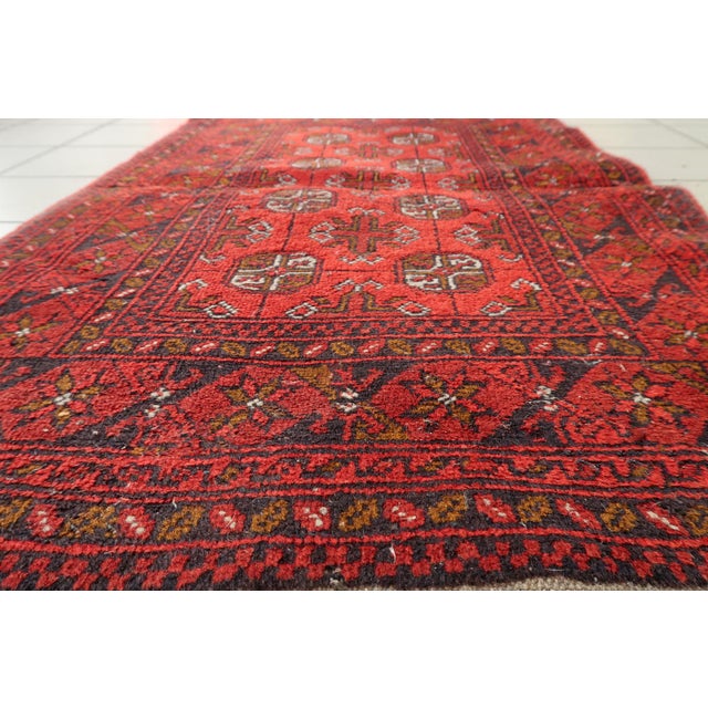 This exceptional antique Afghan Ersari rug, dating back to the 1920s, is a testament to the enduring artistry of the...