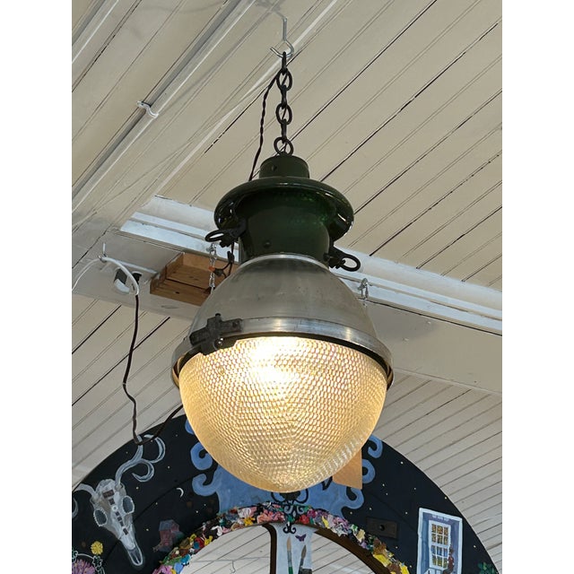 Great looking vintage industrial pair of factory acorn shaped pendant lights having green enamel at the top, silver metal...