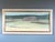 FIELDS AT FIRST LIGHT Size: 19.7 x 39.4 inches (including frame) Oil on canvas A tranquil mid-century landscape that...