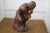 A lovely plaster reproduction of Rodin's The Thinker sculpture! Made of plaster and coated in a bronze paint, this heavy...