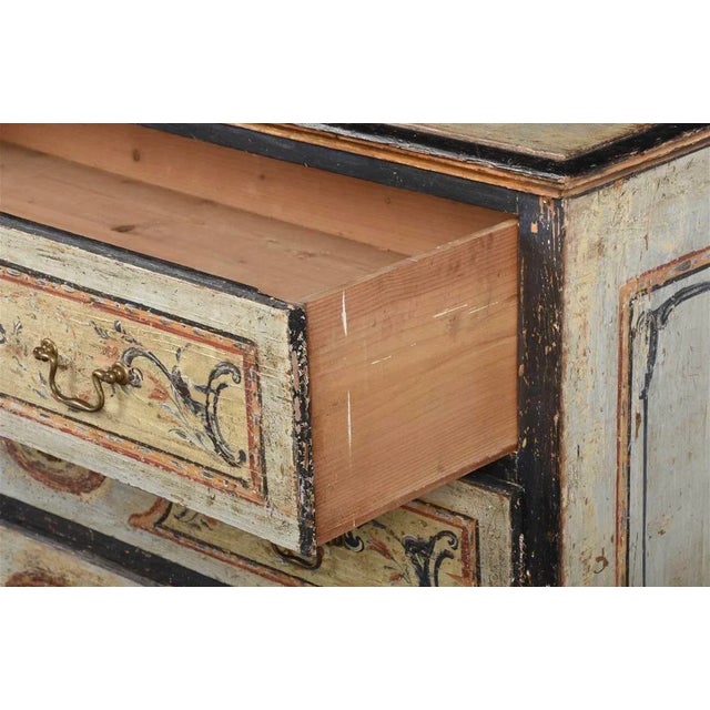 Italian, 18th century, case with pale blue paint with ebonized moldings and mustard, terracotta, and dark blue painted...