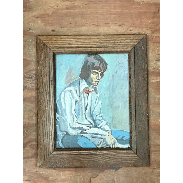 This vintage portrait painting captures a contemplative seated figure through confident brushwork and a quietly expressive...