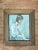This vintage portrait painting captures a contemplative seated figure through confident brushwork and a quietly expressive...