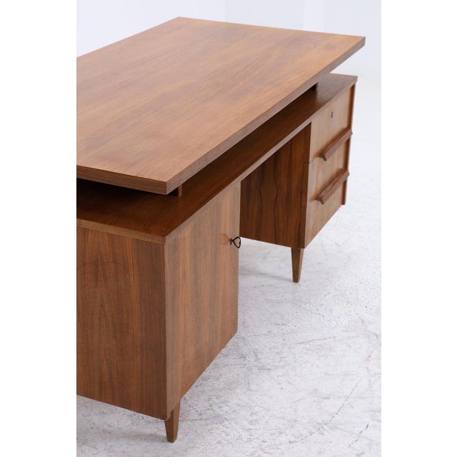 Wonderful vintage desk from the 1960s • Vintage desk with a warm wood finish • Generous rectangular worktop • Three...