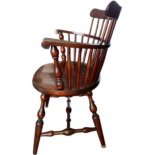 A handsome set of six classic American Windsor captain's chairs by the renowned J.S. Bent & Brothers of Gardner,...