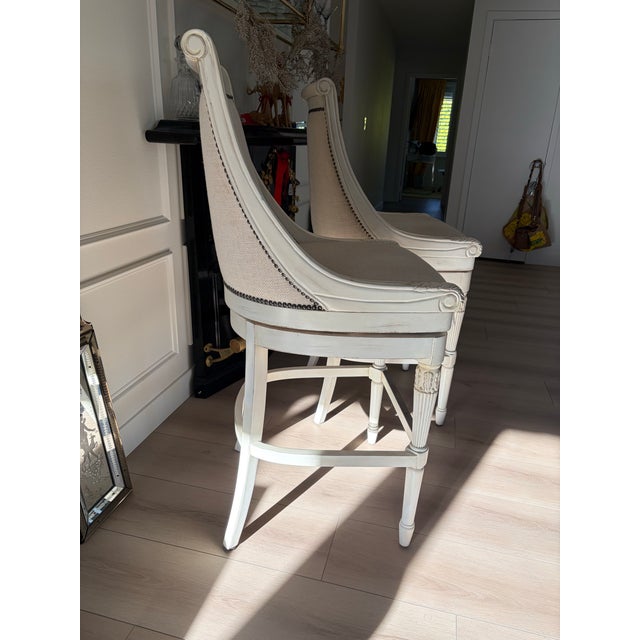 Beautiful Frontgate swivel Bar stools. Solid wood frames with classic carved detailing, neutral upholstered seats with...